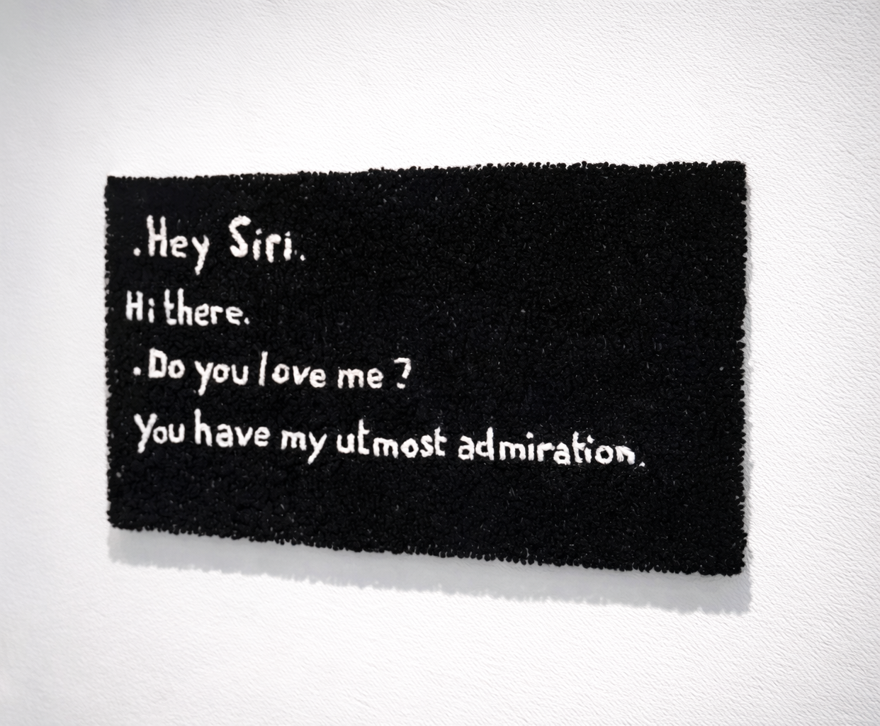 &Eacute;va Ostrowska, Hey Siri Do You Love Me, hand-tufted wool tapestry depicting a conversation with Siri about love and emotional needs, contemporary textile art about human-AI relationships and digital loneliness, 2020