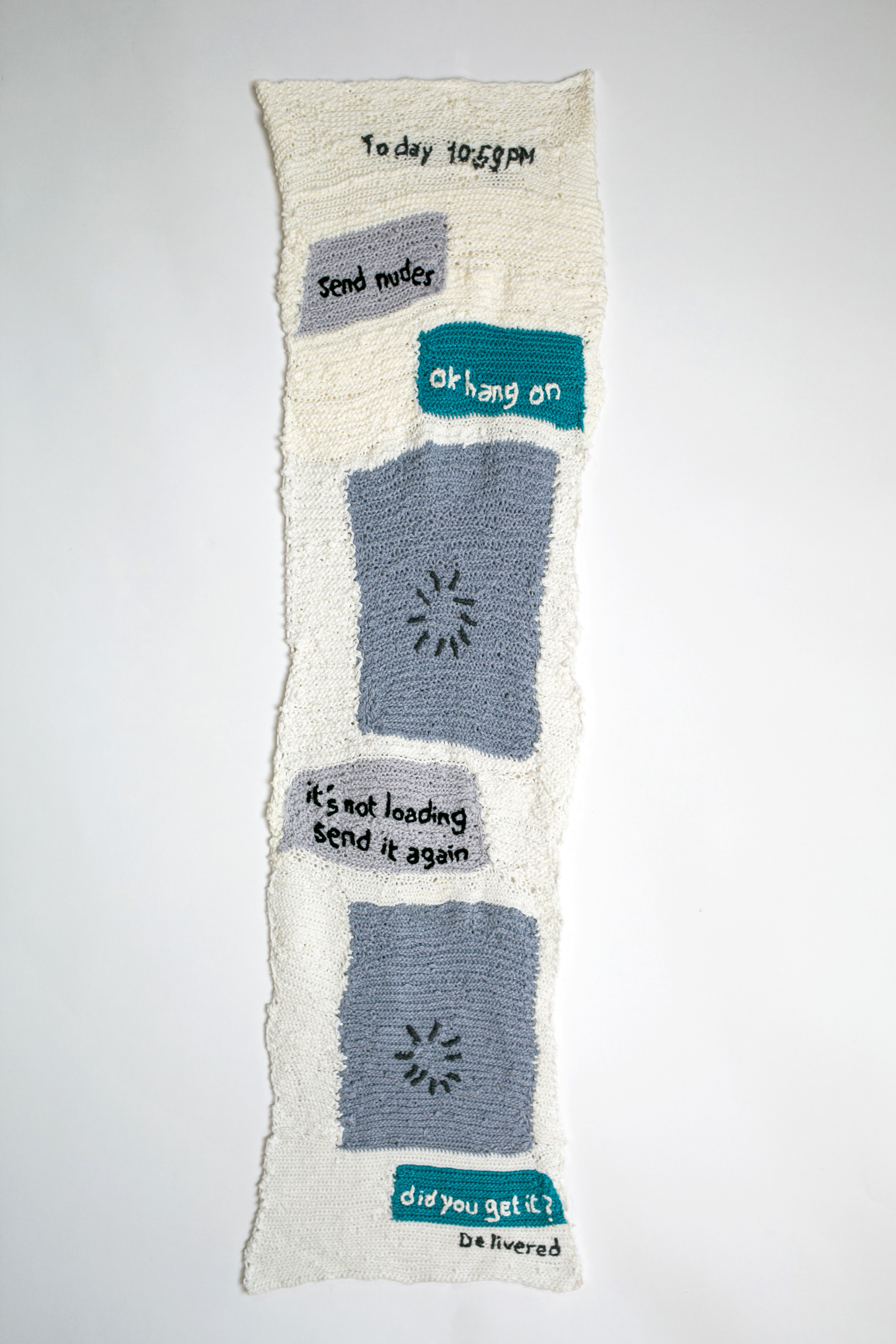 &Eacute;va Ostrowska, I have been sending him a picture of a loading sign instead and he still hasn't realized, knitted wool sculpture resembling a digital loading screen symbolizing ghosting in online dating, contemporary textile art, 226 &times; 69 cm, 2021