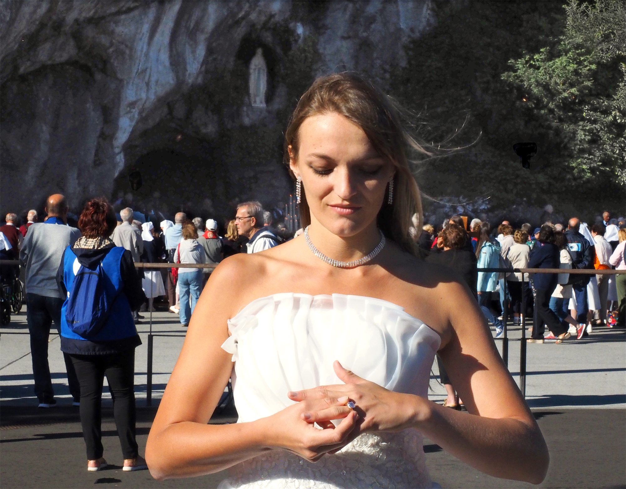 Éva Ostrowska placing the ring on her own finger before the Grotto of Massabielle, Lourdes, 16 July 2016, self-marriage performance